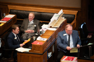 Charles Scott laughing at a joke on the floor