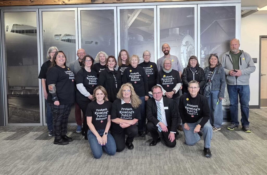 Teachers, parents, and members of the community posse for a photo after showing up to advocate on behalf of Wyoming public education.